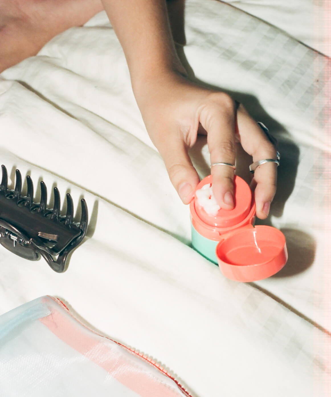 Person applying Hydrating Moisturizer. Skincare products for normal to dry skin. Free of alcohol, parabens, fragances. Cruelty free and vegan.