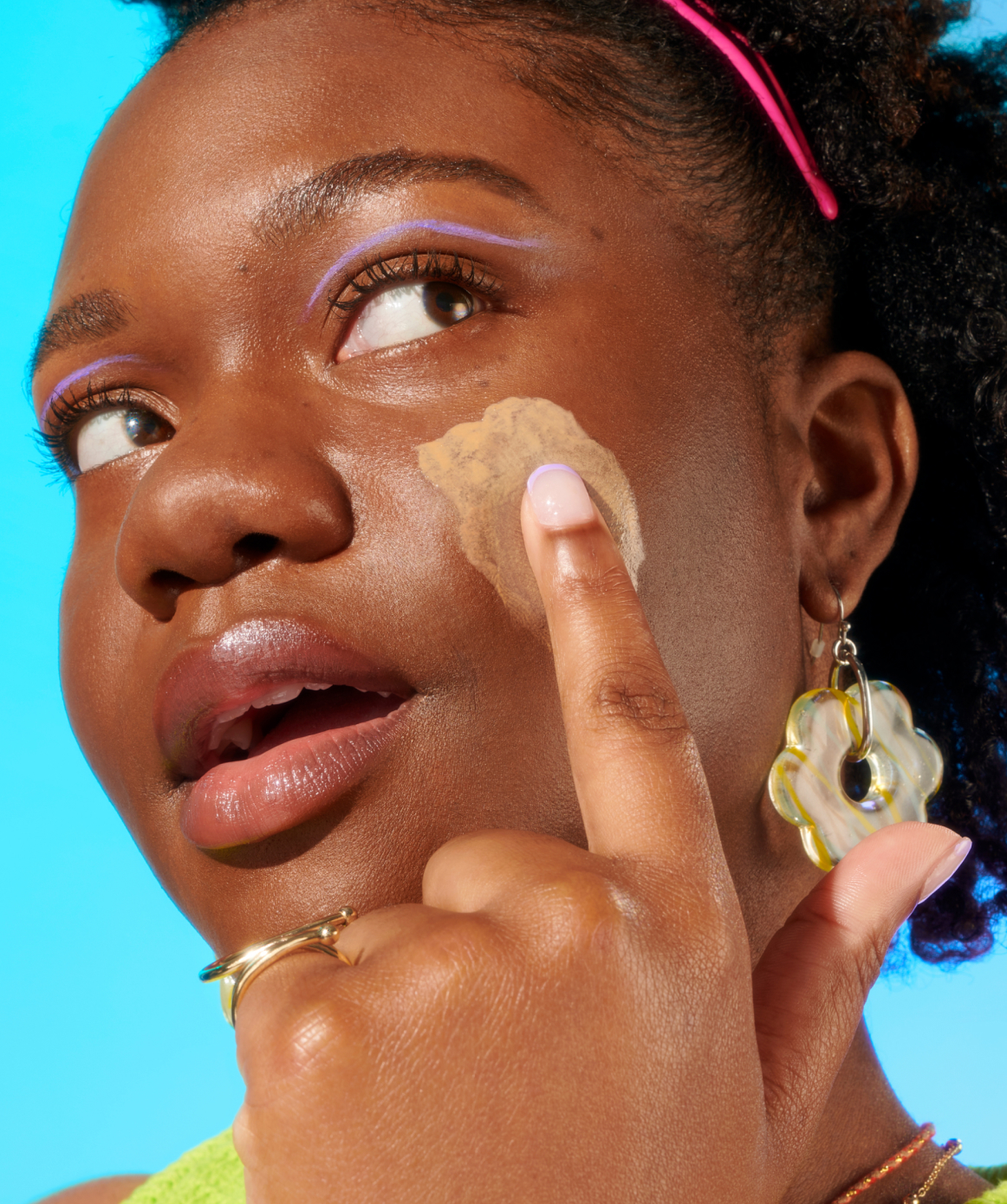 Woman applying sunscreen SPF 40